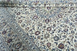 Close-up detail of 2000s Kashan rug from Iran / Persia showing Wool weave