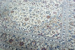 Close-up detail of 2000s Kashan rug from Iran / Persia showing Wool weave