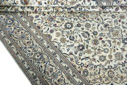 Close-up detail of 2000s Kashan rug from Iran / Persia showing Wool weave
