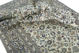 Surface texture of 2000s Kashan rug with natural Wool and intricate pattern