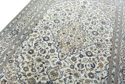 Backside of handmade 2000s Kashan rug showing knot structure and weave density