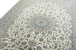 Backside of handmade 2000s Kashan rug showing knot structure and weave density