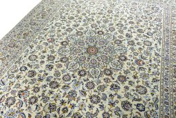 Backside of handmade 2000s Kashan rug showing knot structure and weave density
