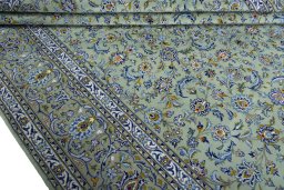 Close-up detail of 2000s Kashan rug from Iran / Persia showing Wool weave