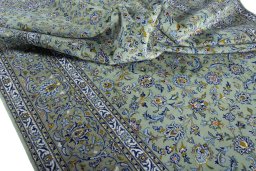 Surface texture of 2000s Kashan rug with natural Wool and intricate pattern