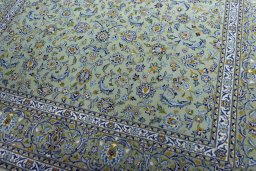 Close-up detail of 2000s Kashan rug from Iran / Persia showing Wool weave