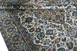 Close-up detail of 2000s Kashan rug from Iran / Persia showing Wool weave