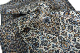 Surface texture of 2000s Kashan rug with natural Wool and intricate pattern