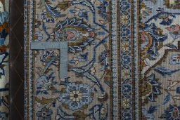 Backside of handmade 2000s Kashan rug showing knot structure and weave density