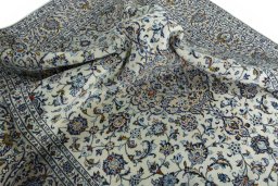 Surface texture of 2000s Kashan rug with natural Wool and intricate pattern