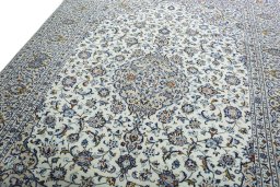 Backside of handmade 2000s Kashan rug showing knot structure and weave density
