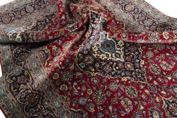 Surface texture of 2000s Kashan rug with natural Cork and intricate pattern