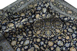Surface texture of 2000s Kashan rug with natural Wool and intricate pattern