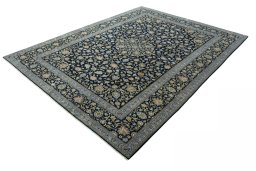 Corner detail of 2000s Kashan rug showing border pattern and Wool pile