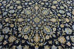 Central medallion detail of 2000s Kashan rug from Iran / Persia