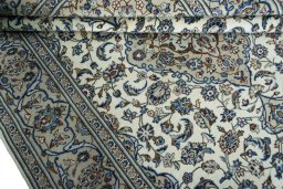 Close-up detail of 2000s Kashan rug from Iran / Persia showing Wool weave