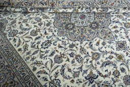 Close-up detail of 2000s Kashan rug from Iran / Persia showing Wool weave