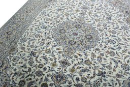 Backside of handmade 2000s Kashan rug showing knot structure and weave density