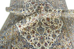Close-up detail of 2000s Kashan rug from Iran / Persia showing Wool weave