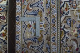 Surface texture of 2000s Kashan rug with natural Wool and intricate pattern