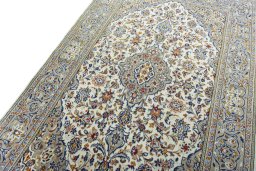 Backside of handmade 2000s Kashan rug showing knot structure and weave density