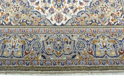 Close-up detail of 2000s Kashan rug from Iran / Persia showing Wool weave