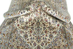 Close-up detail of 2000s Kashan rug from Iran / Persia showing Wool weave