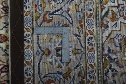 Surface texture of 2000s Kashan rug with natural Wool and intricate pattern