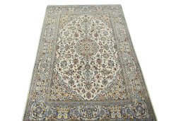 Surface texture of 2000s Kashan rug with natural Wool and intricate pattern