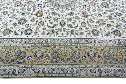 Corner detail of 2000s Kashan rug showing border pattern and Wool pile