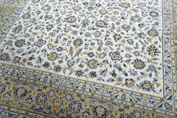 Close-up detail of 2000s Kashan rug from Iran / Persia showing Wool weave