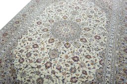 Backside of handmade 2000s Kashan rug showing knot structure and weave density