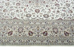 Corner detail of 2000s Kashan rug showing border pattern and Wool pile