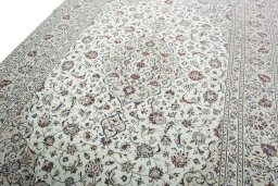 Backside of handmade 2000s Kashan rug showing knot structure and weave density