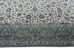 Corner detail of 1970s Kashan rug showing border pattern and Wool pile