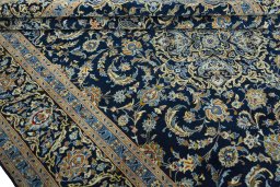 Close-up detail of 2000s Kashan rug from Iran / Persia showing Wool weave