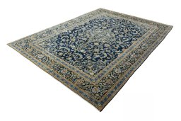 Corner detail of 2000s Kashan rug showing border pattern and Wool pile