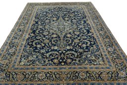 Surface texture of 2000s Kashan rug with natural Wool and intricate pattern