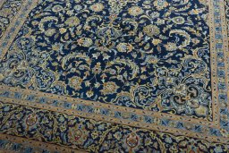 Close-up detail of 2000s Kashan rug from Iran / Persia showing Wool weave