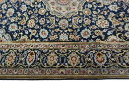 Corner detail of 1970s Kashan rug showing border pattern and Wool pile