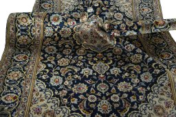 Surface texture of 1970s Kashan rug with natural Wool and intricate pattern