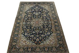 Surface texture of 1970s Kashan rug with natural Wool and intricate pattern