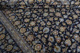 Close-up detail of 2000s Kashan rug from Iran / Persia showing Wool weave
