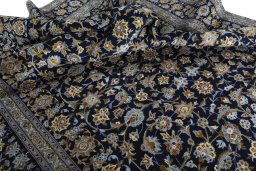 Surface texture of 2000s Kashan rug with natural Wool and intricate pattern
