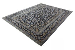 Corner detail of 2000s Kashan rug showing border pattern and Wool pile