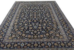Surface texture of 2000s Kashan rug with natural Wool and intricate pattern