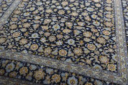 Close-up detail of 2000s Kashan rug from Iran / Persia showing Wool weave