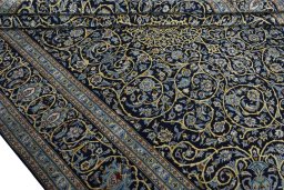 Close-up detail of 2000s Kashan rug from Iran / Persia showing Wool weave