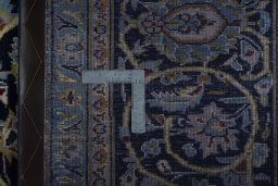 Backside of handmade 2000s Kashan rug showing knot structure and weave density