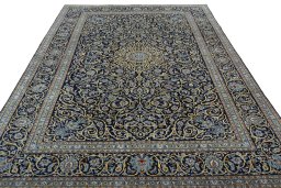 Surface texture of 2000s Kashan rug with natural Wool and intricate pattern